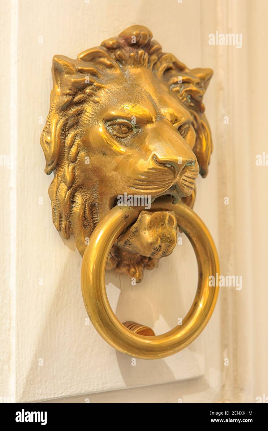 Traditional brass lion-shaped Maltese door knocker in Valletta, Malta Stock Photo
