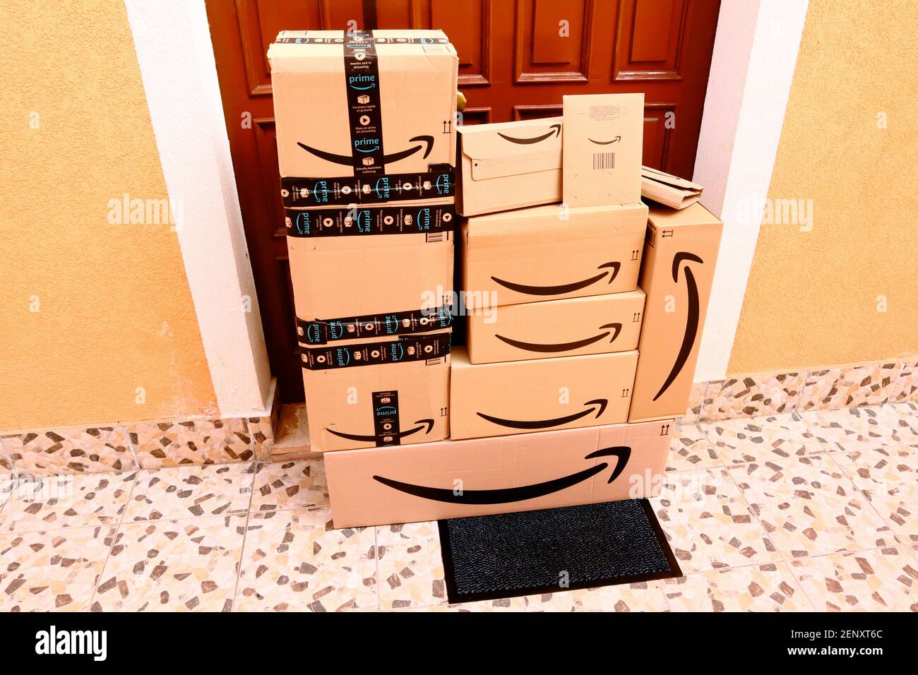 AMAZON Cardboard Boxes delivered at home to the front door Stock Photo