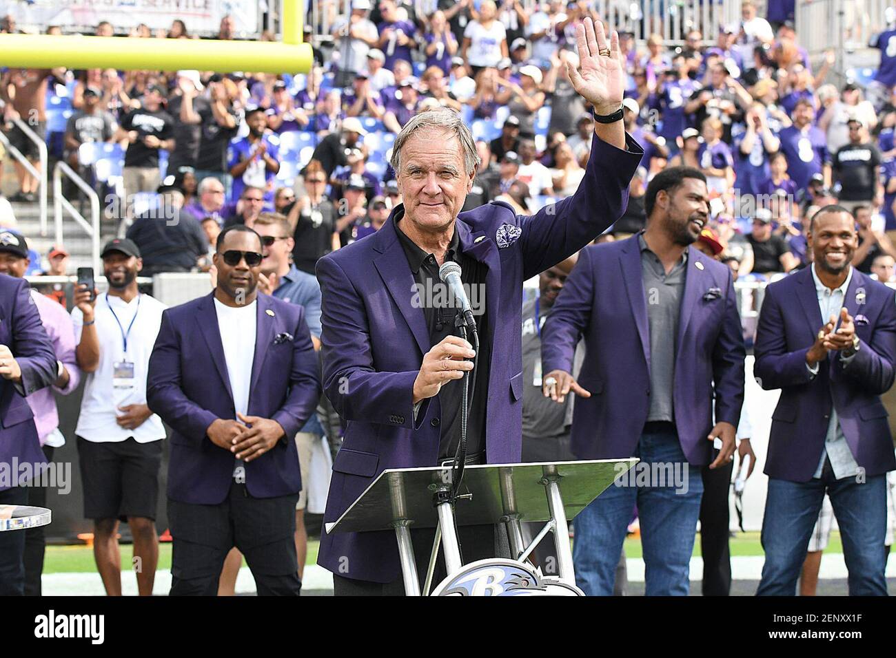 Baltimore Ravens head coach Brian Billick holds the Lombardi Trophy after  defeating the New York Giants, 34-7, to win Super Bowl XXXV as linebacker  Ray Lewis, the game's MVP, right, speaks with