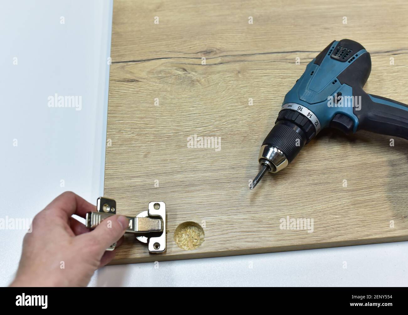 Cordless combi drill for assembly the furniture door hinges ot he