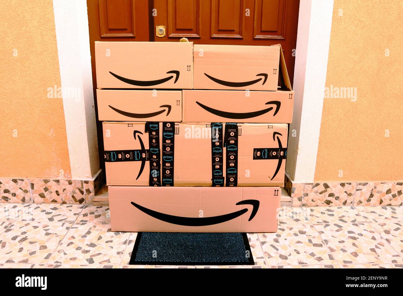 AMAZON Cardboard Boxes delivered at home to the front door Stock Photo