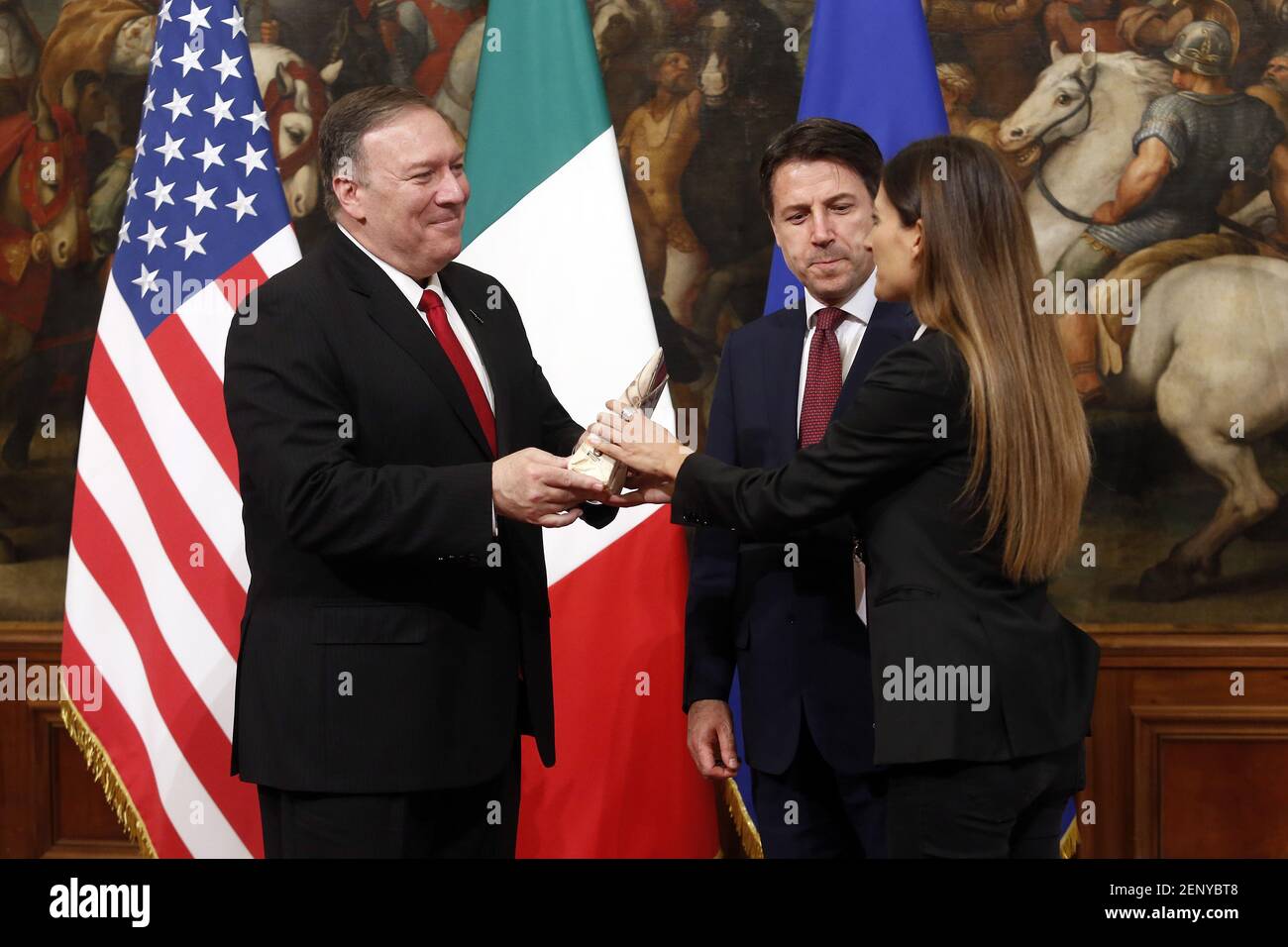 During the photo family U.S. Secretary of State Mike Pompeo is given a