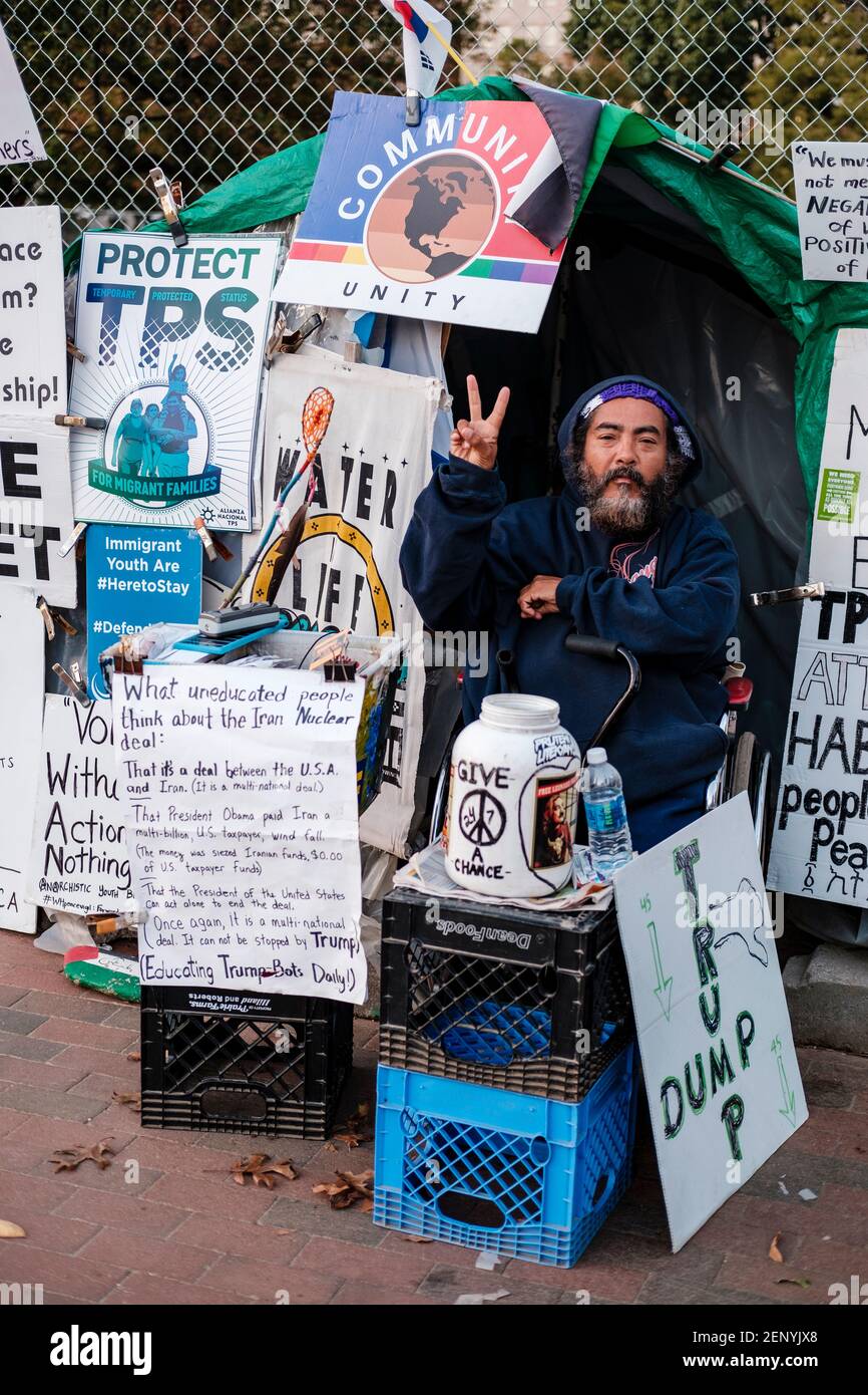 Peace vigil, male peace activist with protest signs in front of the White House, Washington D.C., USA Stock Photo