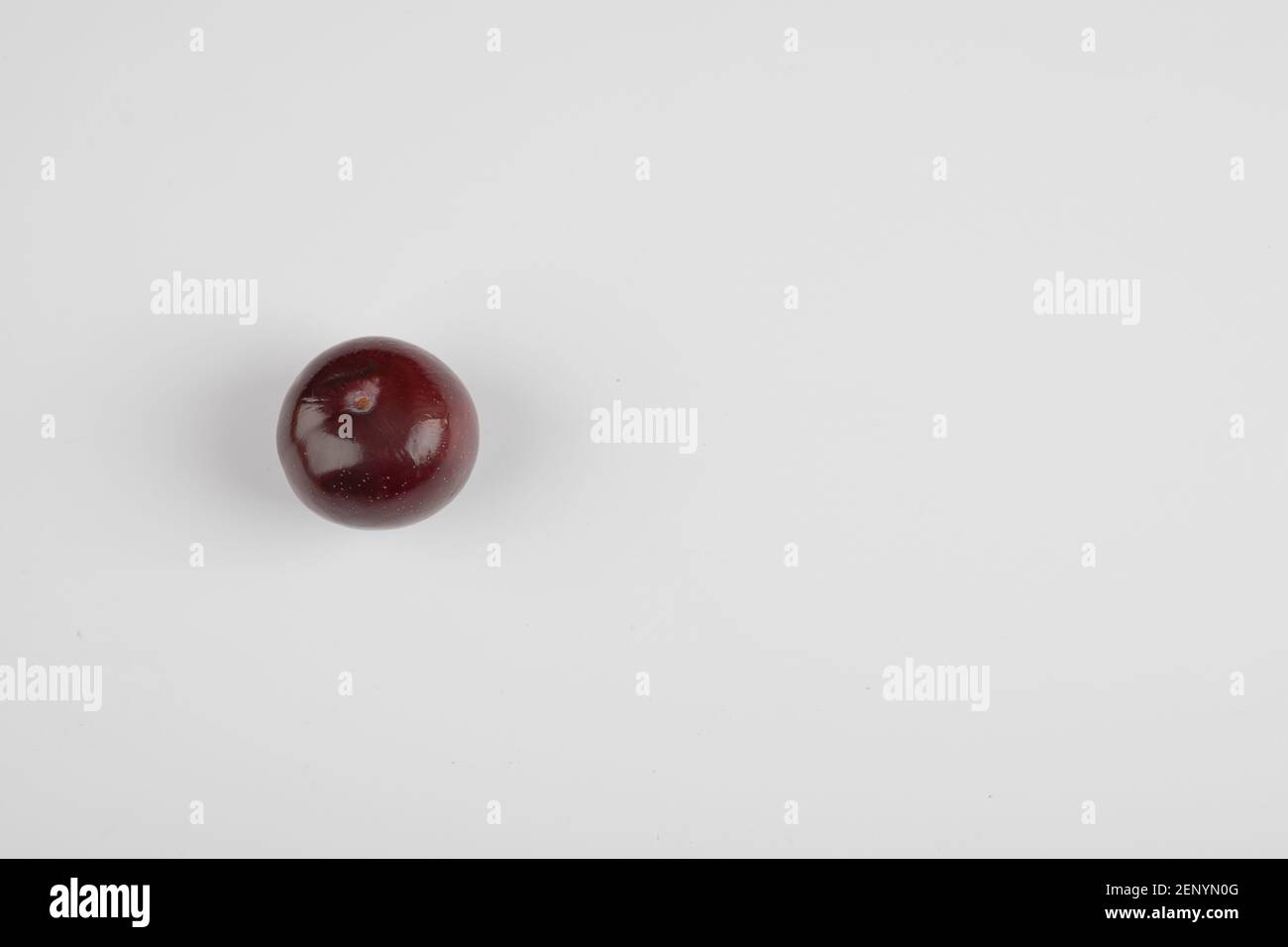 Single cherry plum isolated on white background Stock Photo