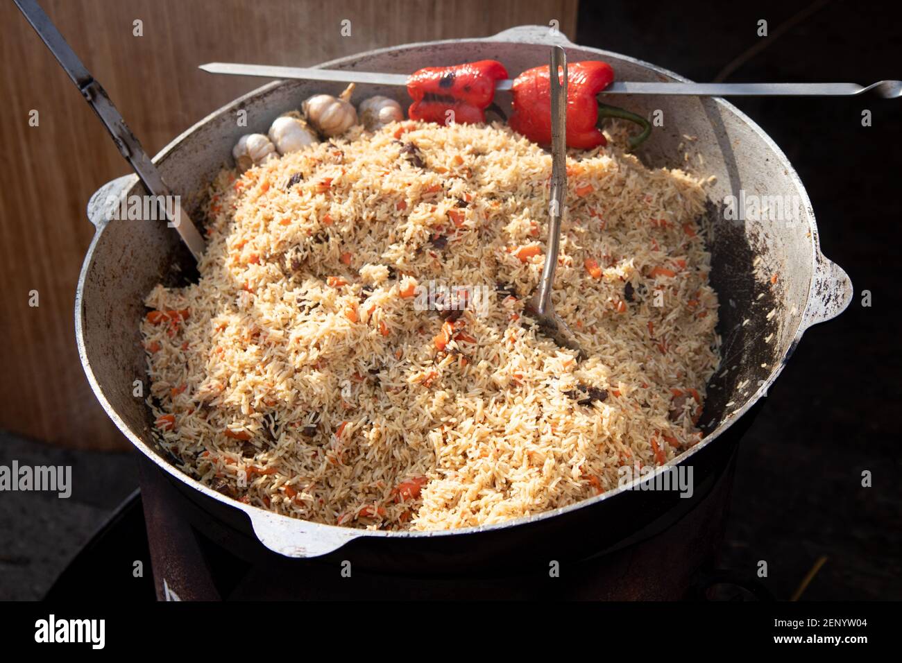 Cooking of traditional pilaf in big cauldron, street food in outdoor Stock Photo Alamy