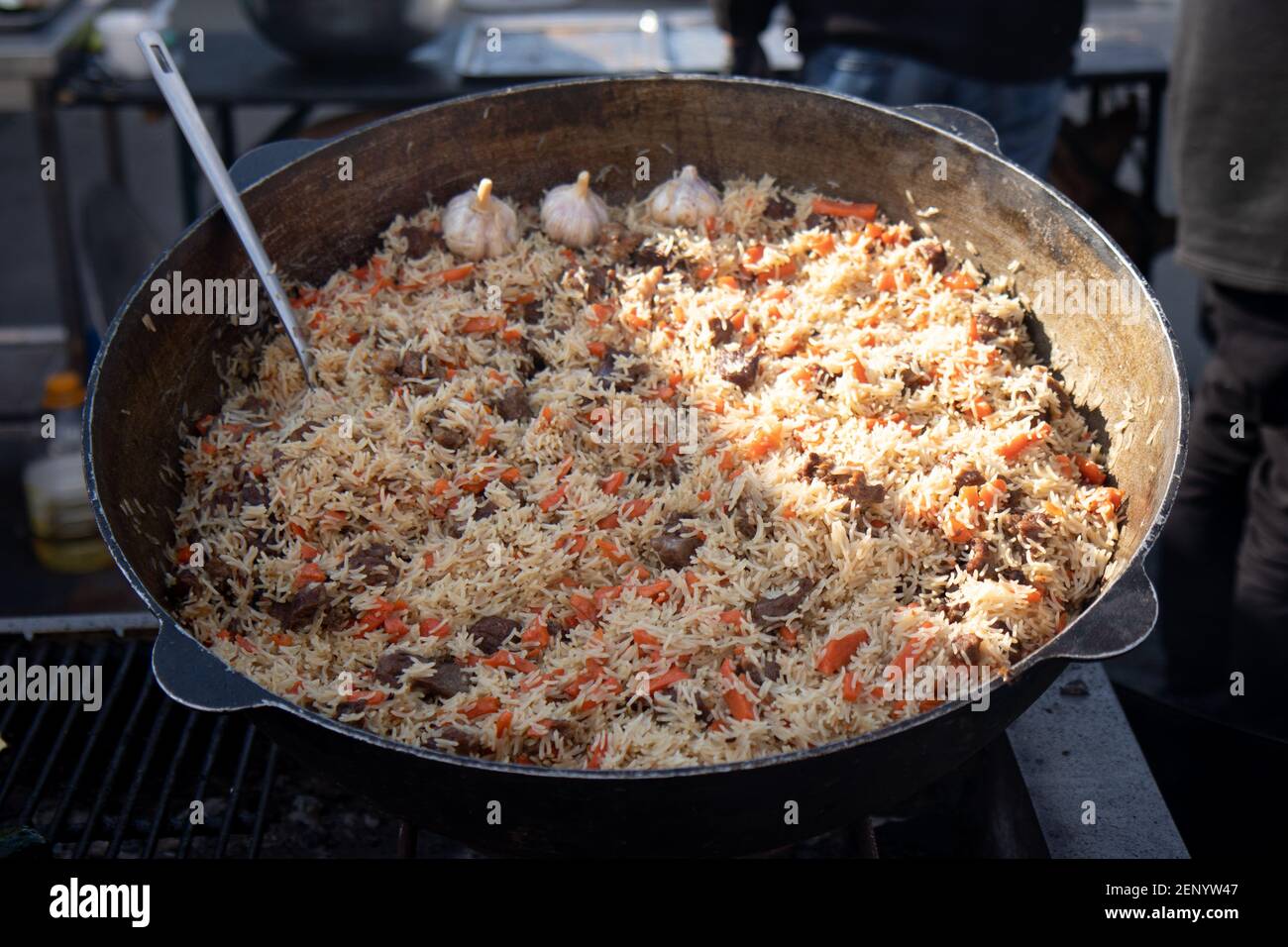 Cooking of traditional pilaf in big cauldron, street food in outdoor Stock Photo Alamy