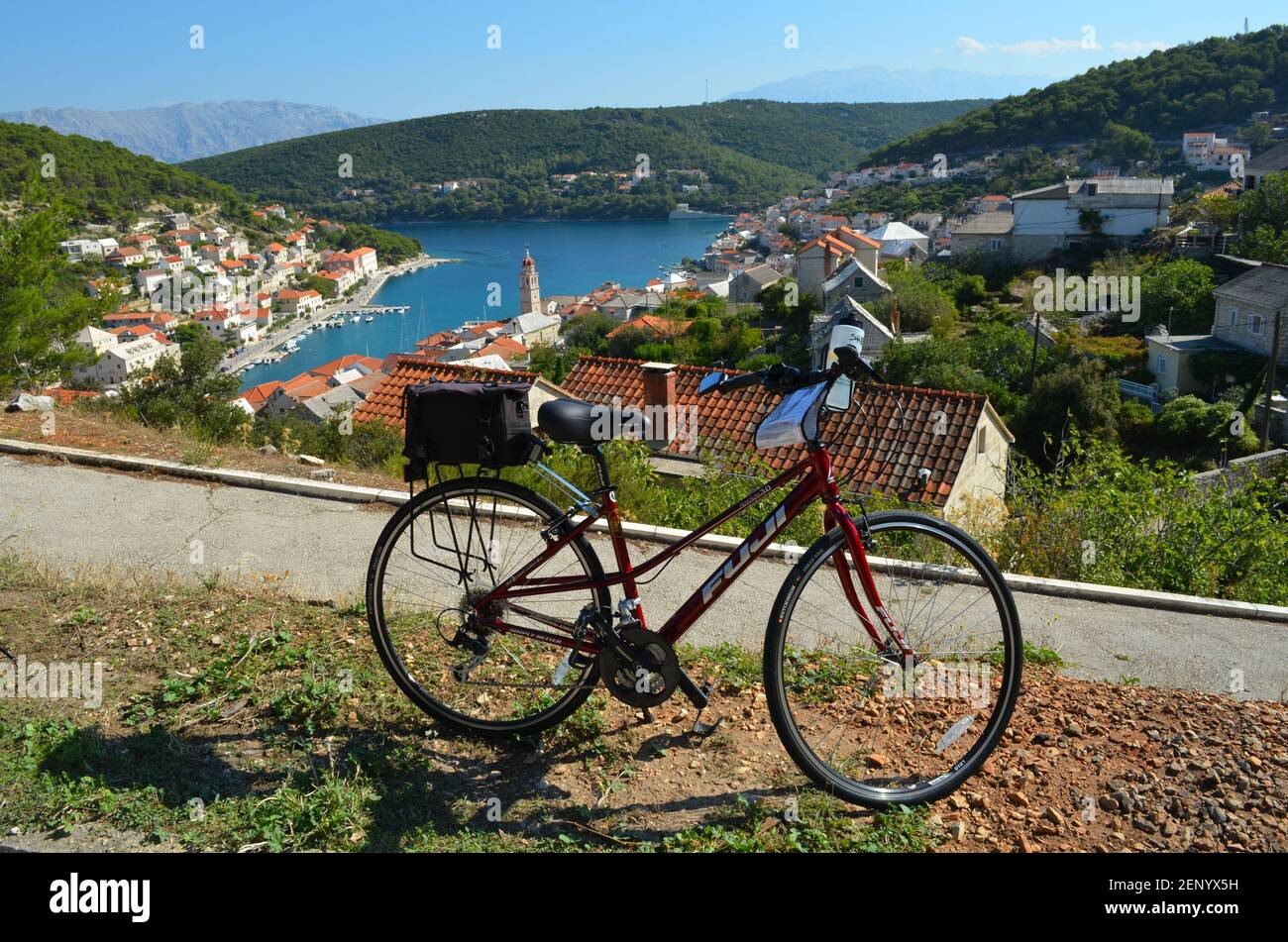 Beautiful blue water of the Adriatic sea, Bicycle touring in the Dalmatian Islands of Croatia, town of Pucsica, Croatian. Stock Photo