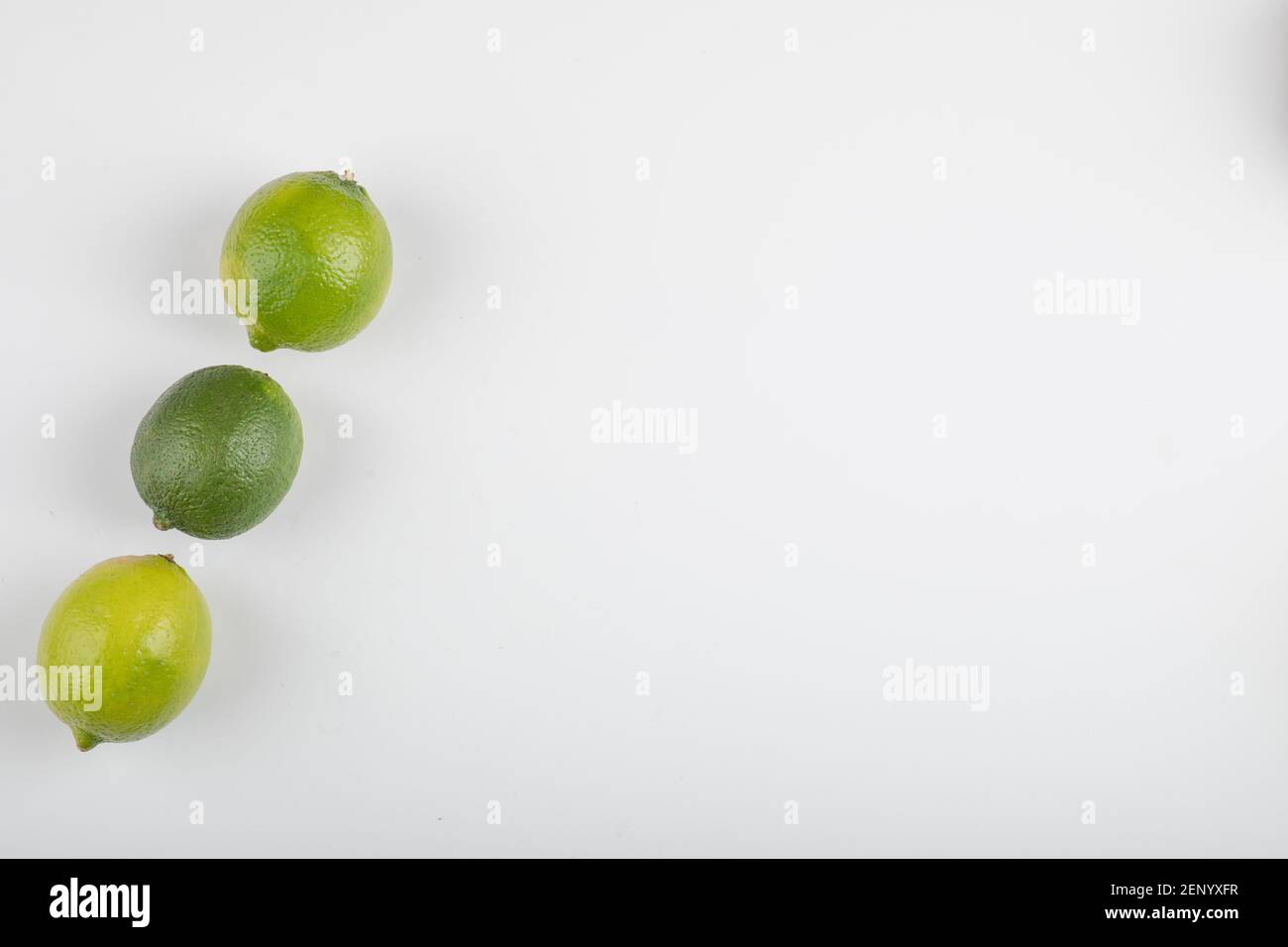 Three ripe lime fruits isolated on white background Stock Photo