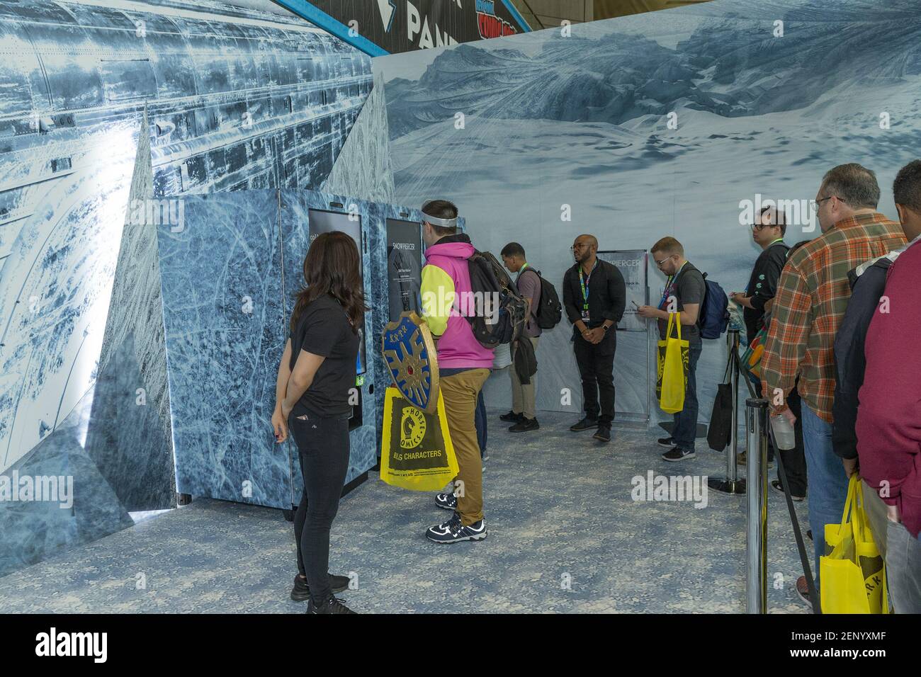 Cosplayers in line for protein bar with crikcets pieces made for Snowpiercer series by Tomorrow