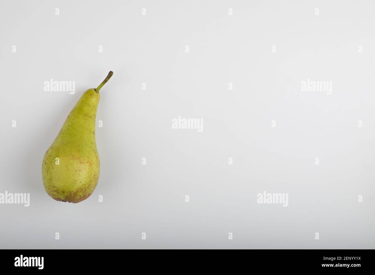 Single whole green pear isolated on white background Stock Photo - Alamy