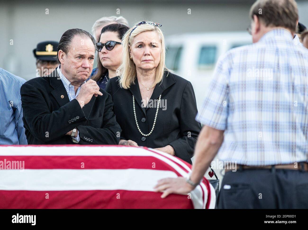Neil and Andrea Bardach watch as an unidentified family member rests his hand on the coffin of 1st Lt. Alan Jensen Bardach as he is repatriated from Vietnam with a planeside honors ceremony at the Indianapolis International Airport on Thursday, October 3, 2019. Neil Bardach is the younger brother of 1st Lt. Alan Jensen Bardach who was killed during the Vietnam War. 0028 4gallery (Photo by Michelle Pemberton/IndyStar, Indianapolis Star via Imagn Content Services, LLC/USA Today Network/Sipa USA) Stock Photo