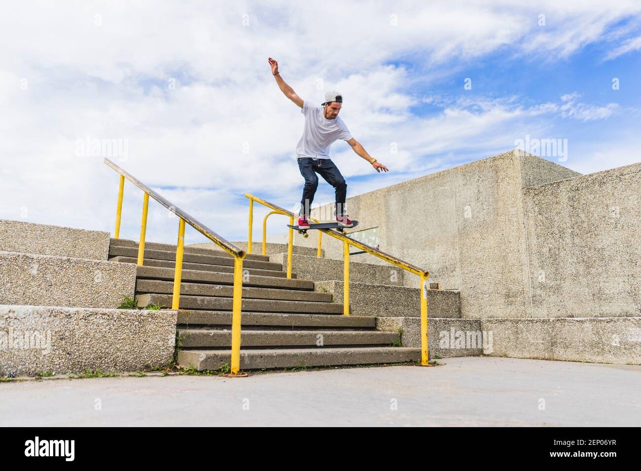 Young skateboarder sliding down handrail on skateboard, Montreal, Quebec,  Canada Stock Photo - Alamy