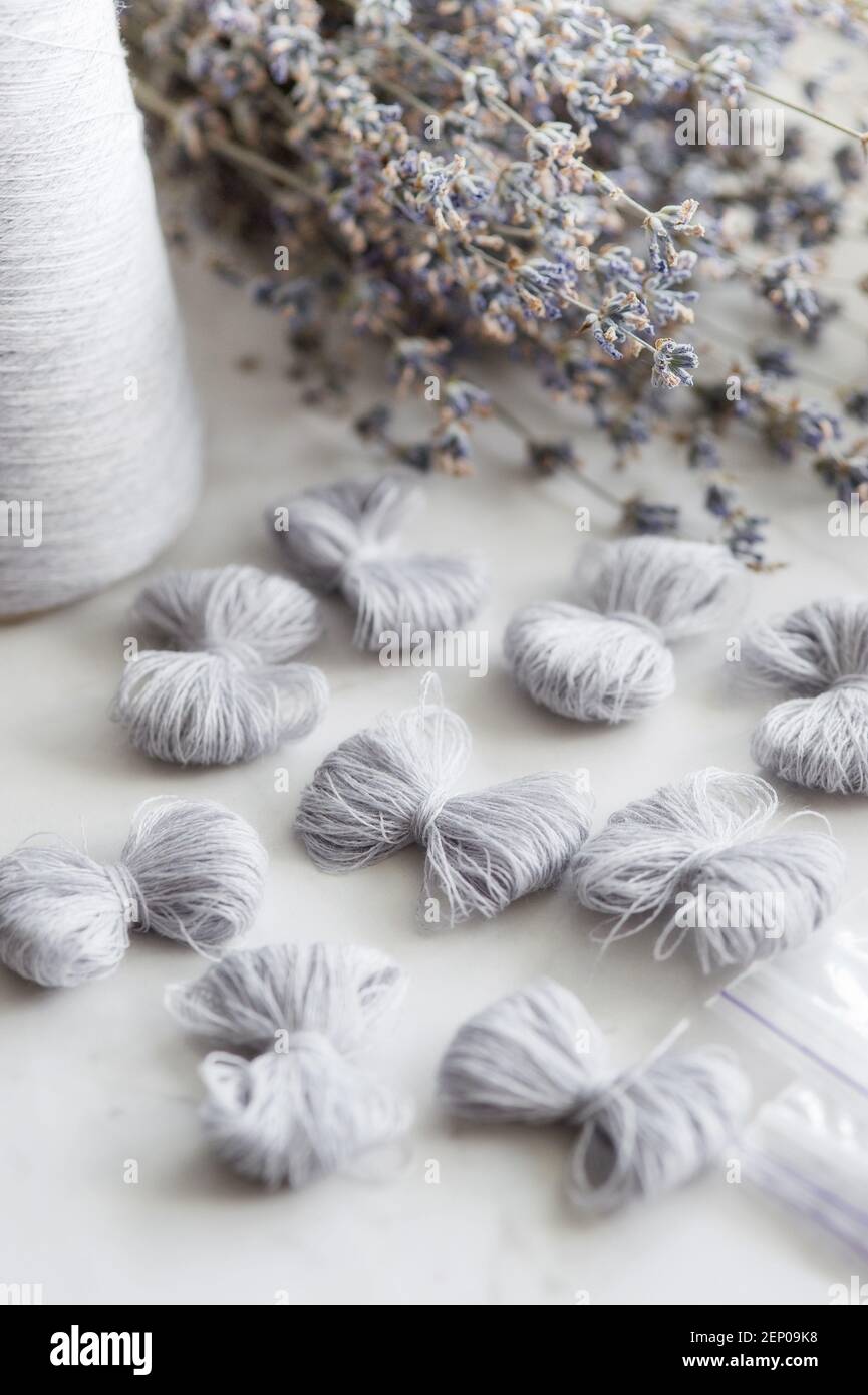 Close-up of grey merino wool bows and lavender. Creativity concept Stock Photo