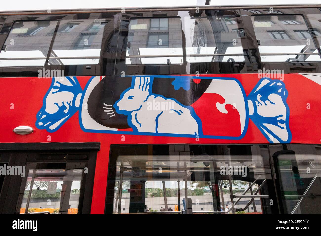 A sightseeing bus with the elements of White Rabbit Canday, a brand of ...