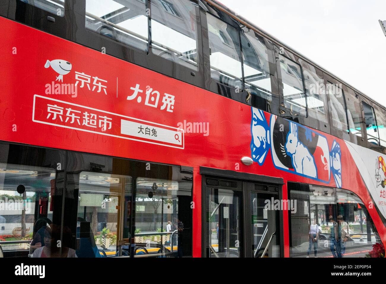 A sightseeing bus with the elements of White Rabbit Canday, a brand of ...