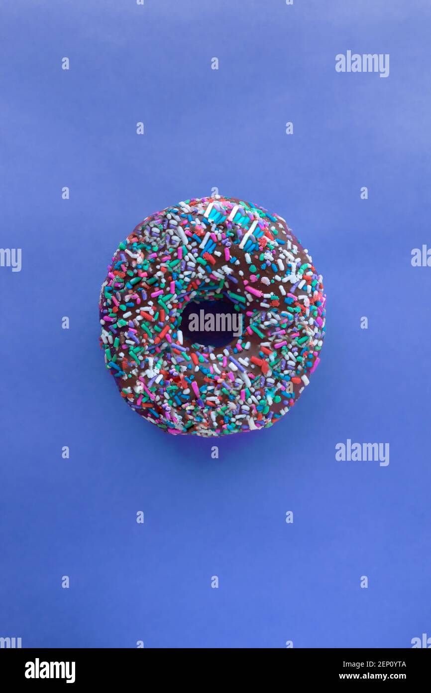 Donut with sprinkles isolated on white background Stock Photo - Alamy