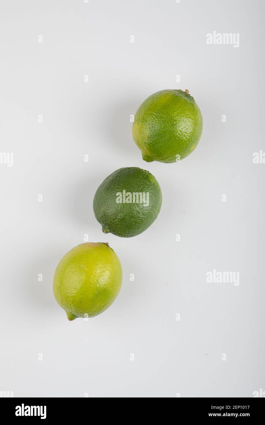 Three ripe lime fruits isolated on white background Stock Photo