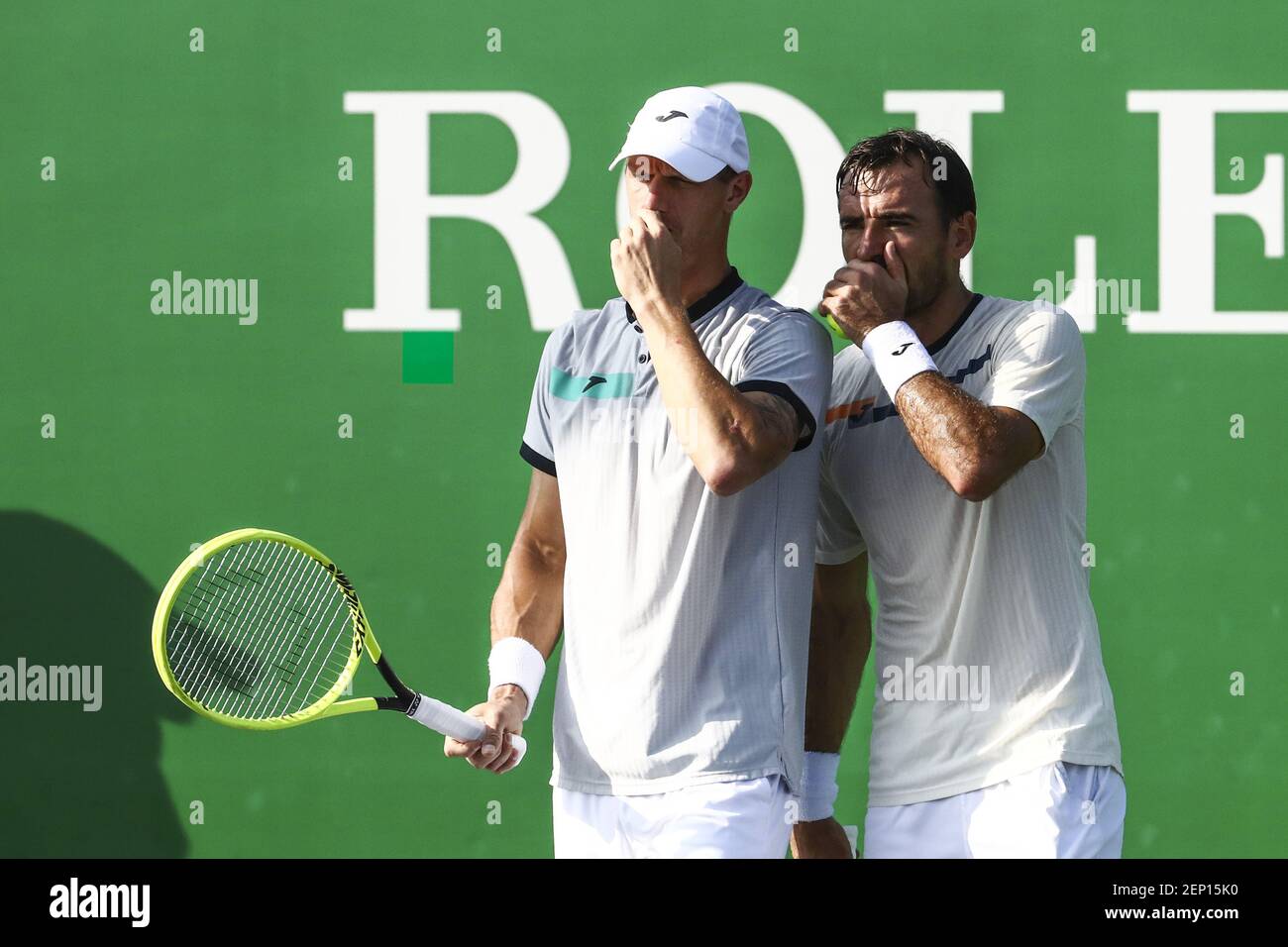 Ivan Dodig of Crotia and Filip Polasek of Slovakia compete against Jean ...