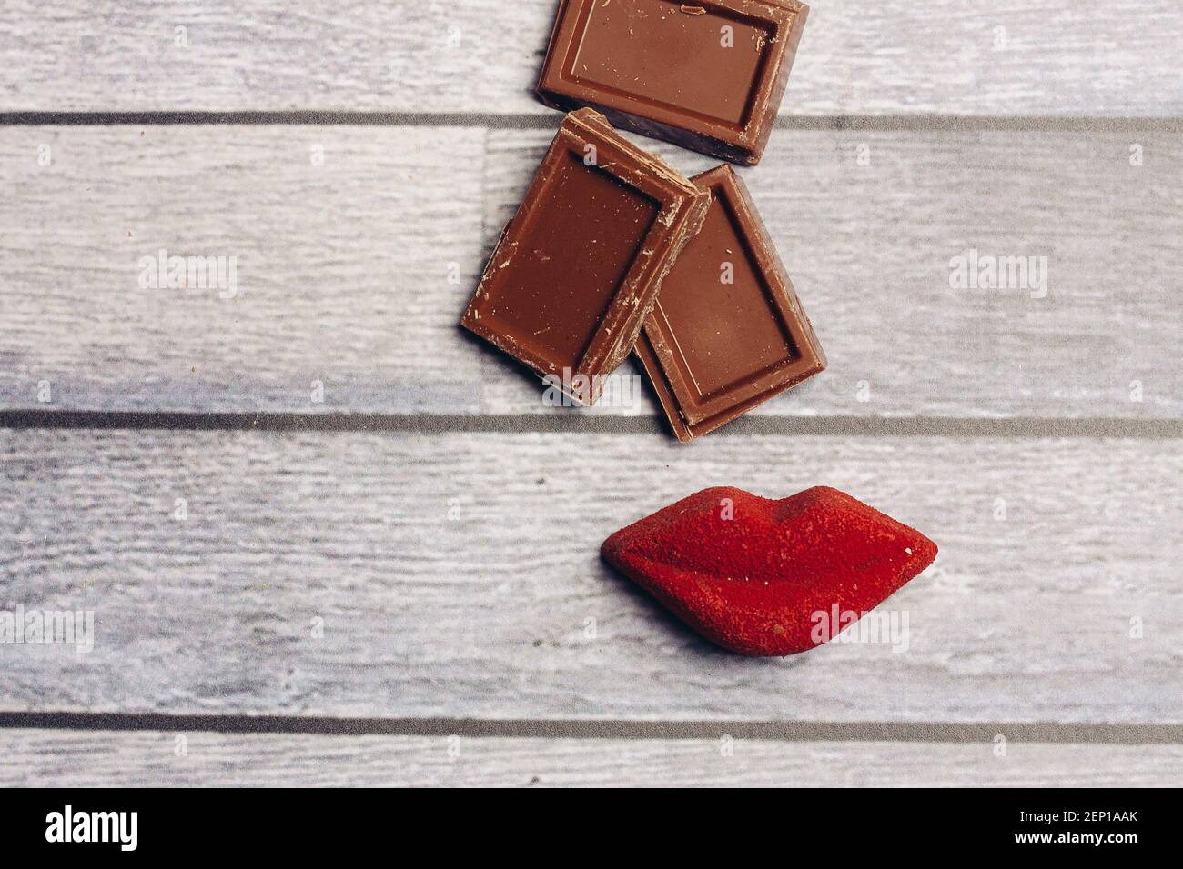 chocolate bar red lips marmalade sweets dessert top view Stock Photo