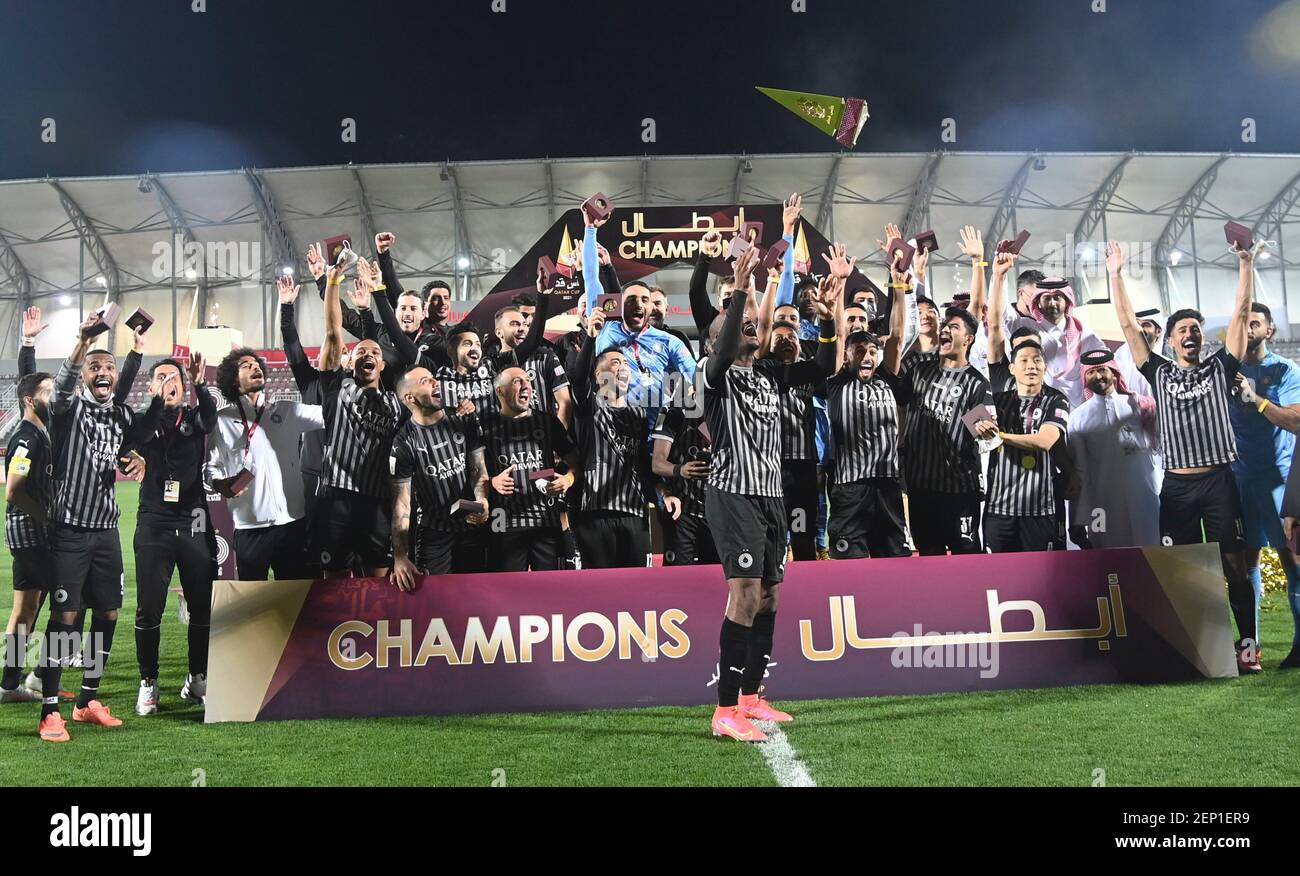 Doha, Qatar. 26th Feb, 2021. Al Sadd SC players celebrate with the trophy after winning the Qatar cup final match between Al Sadd SC and Al Duhail SC in Doha, Qatar, Feb. 26, 2021. Credit: Nikku/Xinhua/Alamy Live News Stock Photo