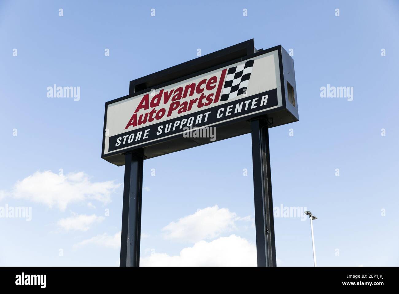 A logo sign outside of the headquarters of Advance Auto Parts in