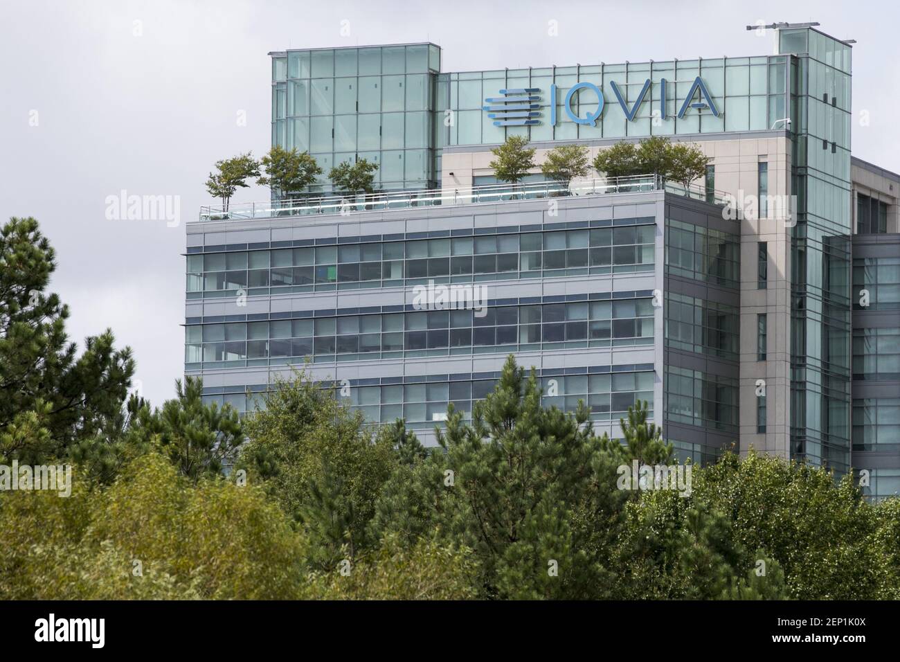 A logo sign outside of the headquarters of IQVIA in Durham, North
