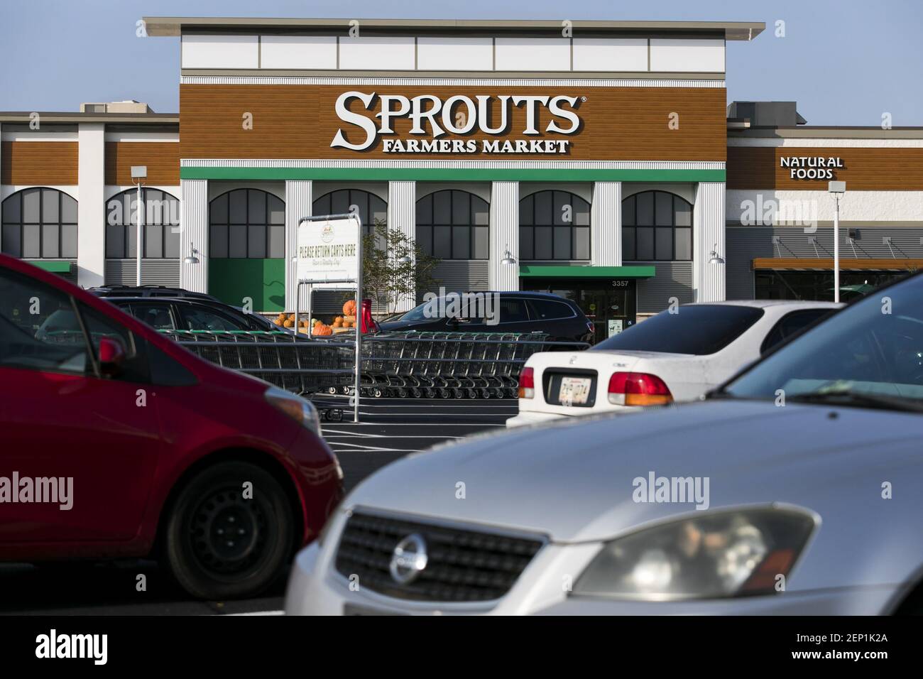A logo sign outside of a Sprouts Farmers Market retail grocery store