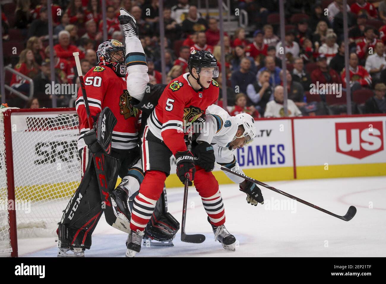 In this image from Oct. 10, 2019, San Jose Sharks left wing Evander Kane (9) falls over Chicago Blackhawks goaltender Corey Crawford (50) and Chicago Blackhawks defenseman Connor Murphy (5) during the second period of the Blackhawks home opener at the United Center in Chicago. During Monday night's win, Crawford made 27 saves. (Photo by Armando L. Sanchez/Chicago Tribune/TNS/Sipa USA) Stock Photo