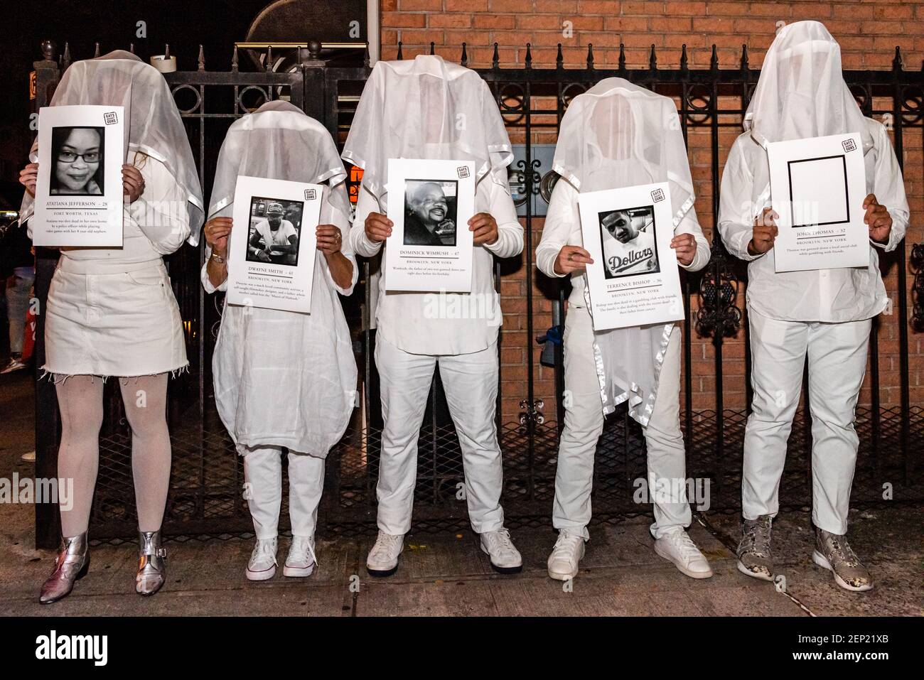 Gays against Guns, a nonviolent anti-gun action group, hold a vigil with the images of the shooting victims, including that of Atatiana Jefferson, who was killed in her home in Dallas, Texas, in front of the Triple A Aces in Crown Heights, Brooklyn, on October 14, 2019. Four men were killed, and three injured at the private social rental place in Crown Heights, early Saturday morning. (Photo by Gabriele Holtermann-Gorden/Sipa USA) Stock Photo