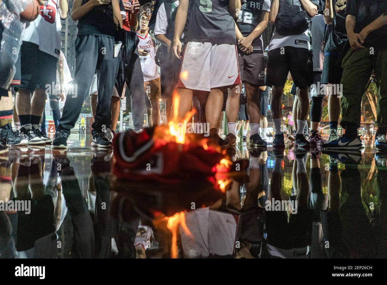 Protesters burn the jersey of Lebron James, during the demonstration.  Hundreds of protesters gathered to express their anger about Lebron James's  tweet and to show support to the General Manager of the