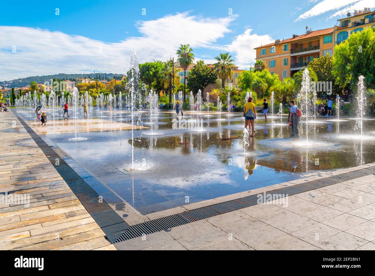 Tourists and local French enjoy a sunny day at Promenade du Paillon