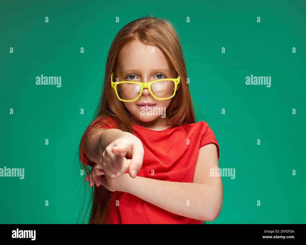 emotional girl with red hair wearing yellow glasses school isolated