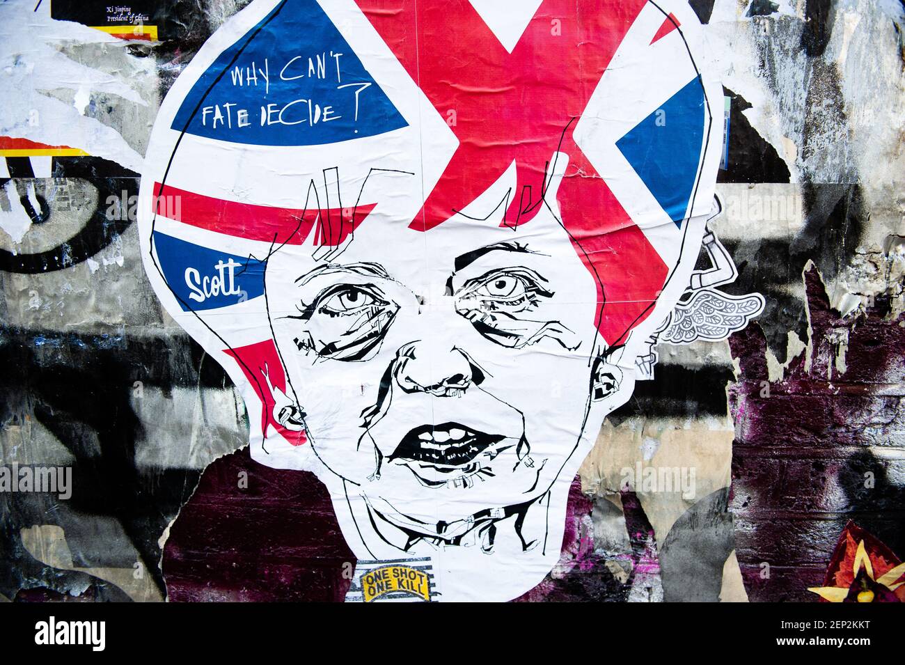 A sticker of Theresa May is seen on a wall. As the Brexit deadline looms, new murals and paste-ups appear on the streets of London. Brick Lane, in London's east end, is one of the most popular places to find all kind of art around the Brexit. Also in the famous district of Shoreditch, tourists walk and take photos around this political street art. (Photo by Ana Fernandez / SOPA Images/Sipa USA)  Stock Photo