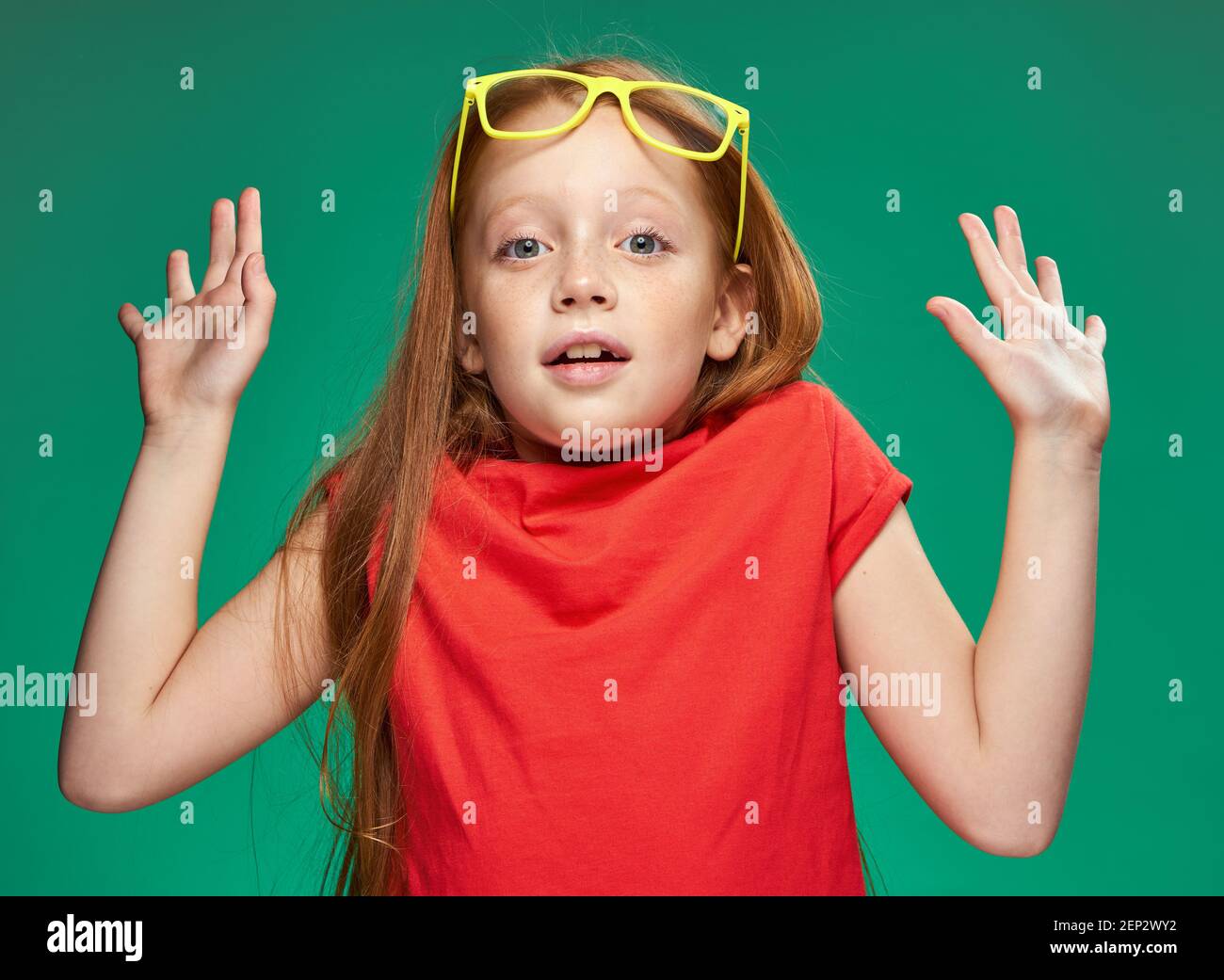 emotional girl with red hair wearing yellow glasses school isolated