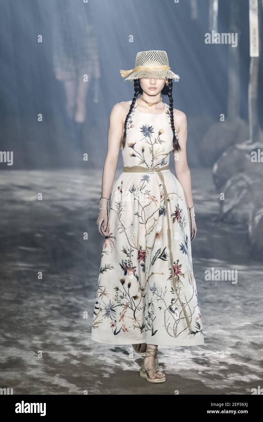 Models wearing newly released Dior clothes walk the runway for 