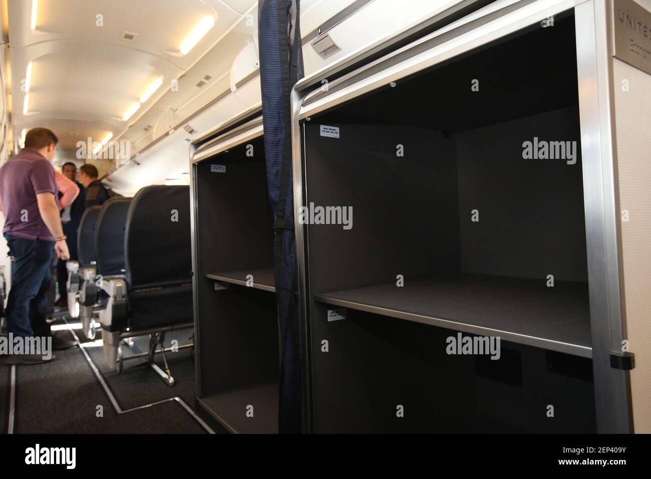 Extra large luggage racks for all passengers are used to divide the United First from the United Economy Plus and United Economy areas aboard the new United Airlines Bombardier CRJ-550 regional jet at Chicago O'Hare International Airport in Chicago on October 24, 2019. (Photo by Stacey Wescott/Chicago Tribune/TNS/Sipa USA) Stock Photo