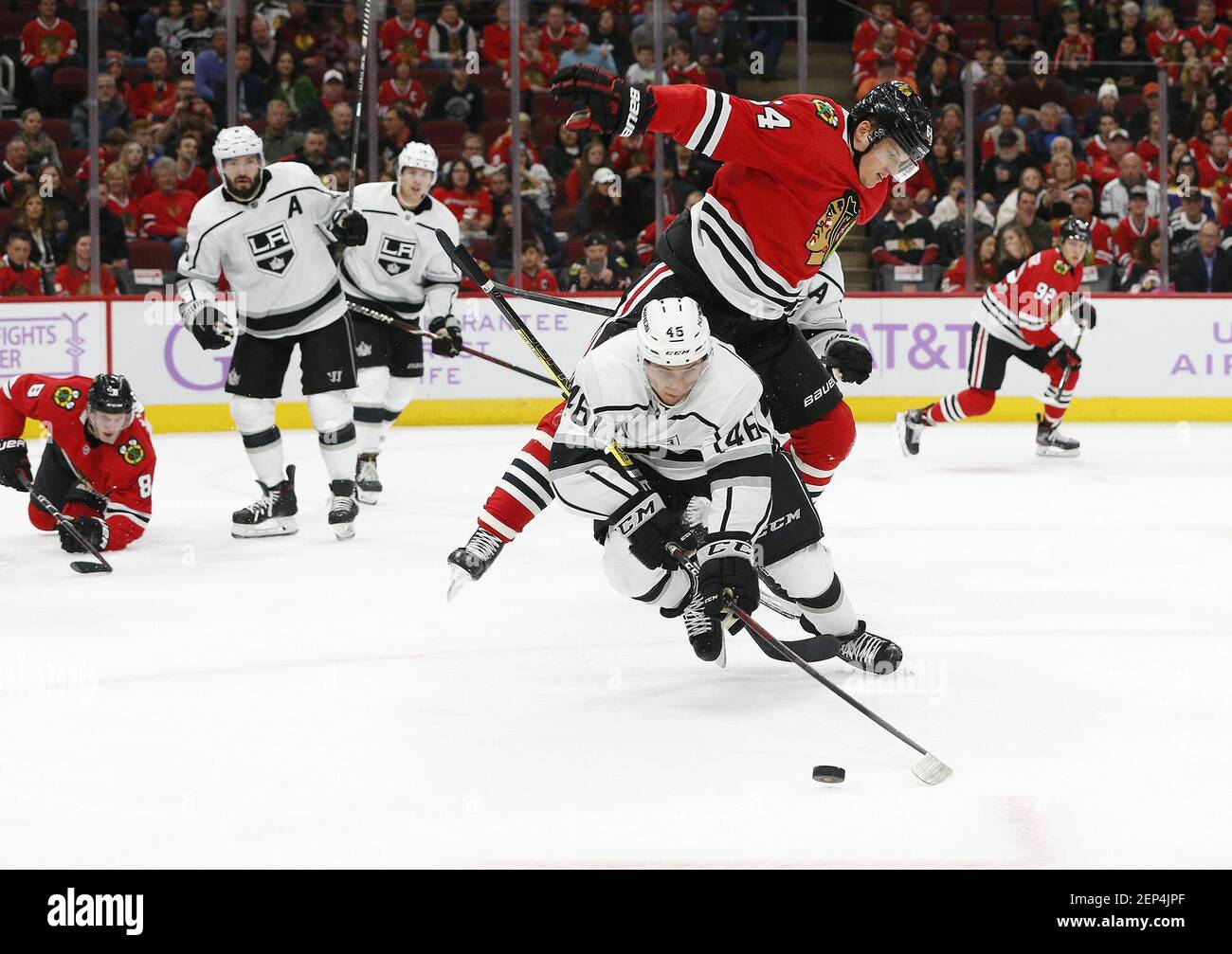 Chicago Blackhawks center David Kampf (64) goes over the top of Los Angeles Kings center Blake Lizotte (46) as they battle for the puck during the first period on Sunday, Oct. 27, 2019 at the United Center in Chicago, Ill. (Stacey Wescott/Chicago Tribune/TNS) Stock Photo