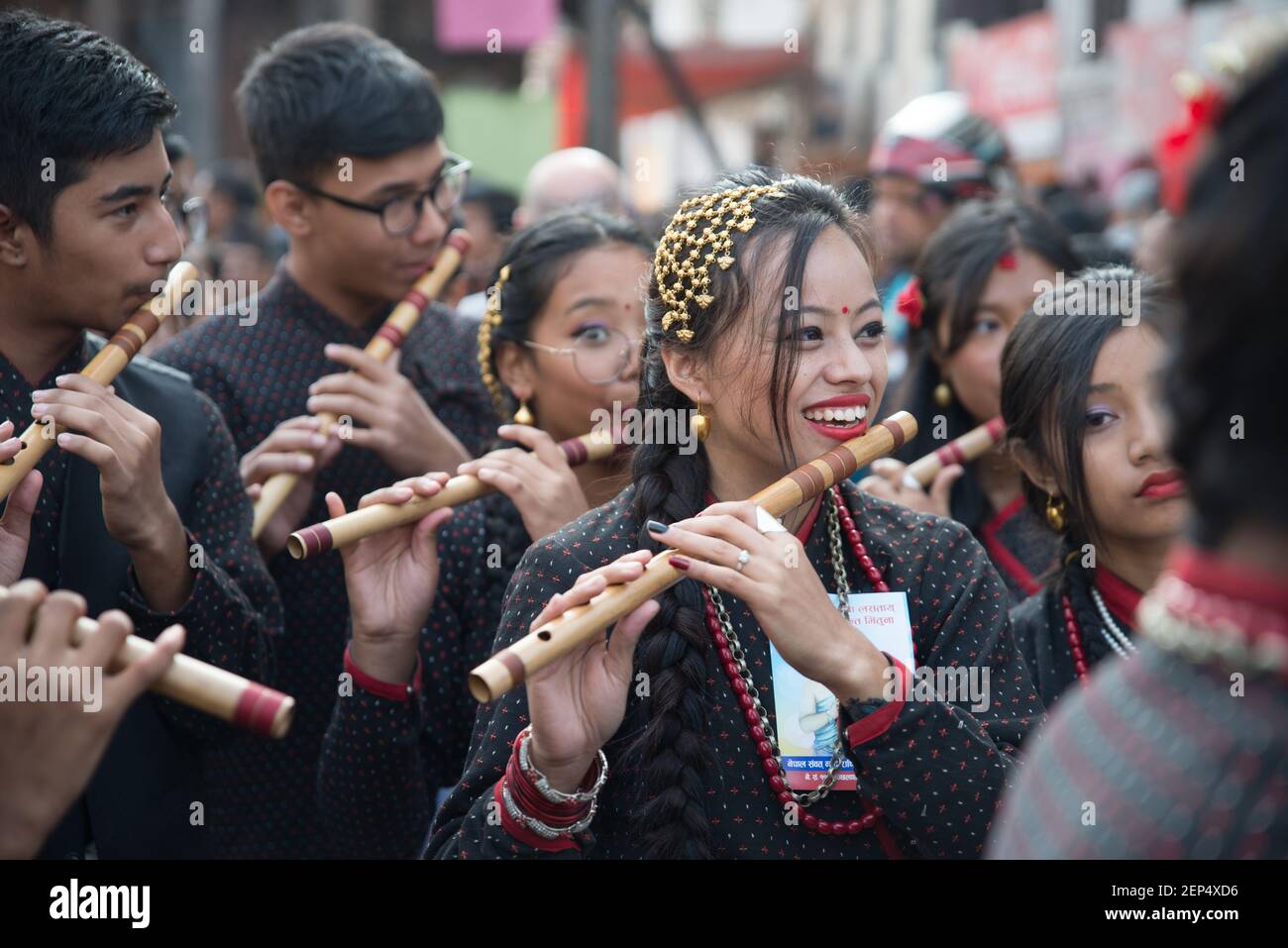 Members of the Nepali ethnic Newar community play flutes during the