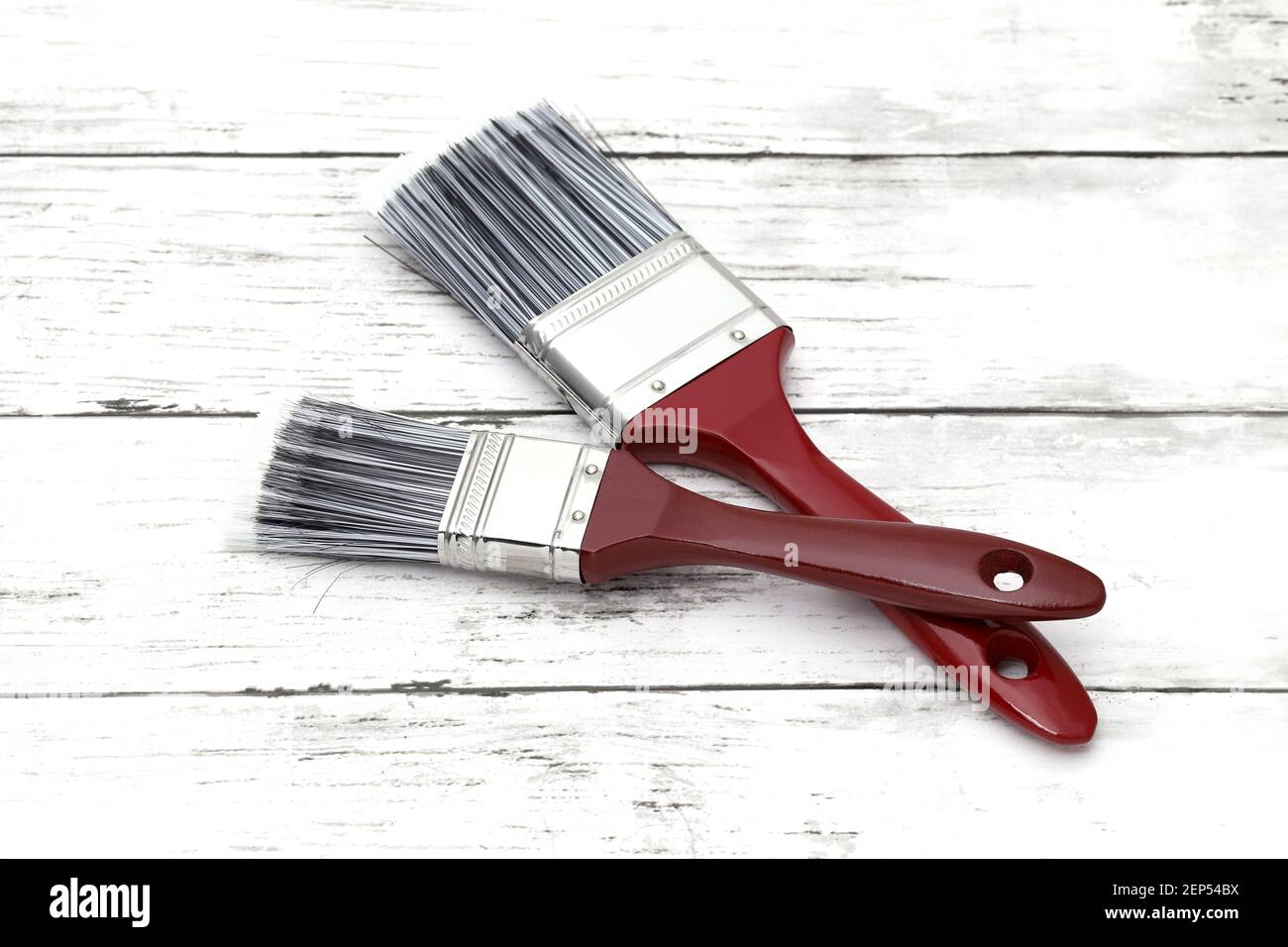 paint brush on grunge wood plank background Stock Photo