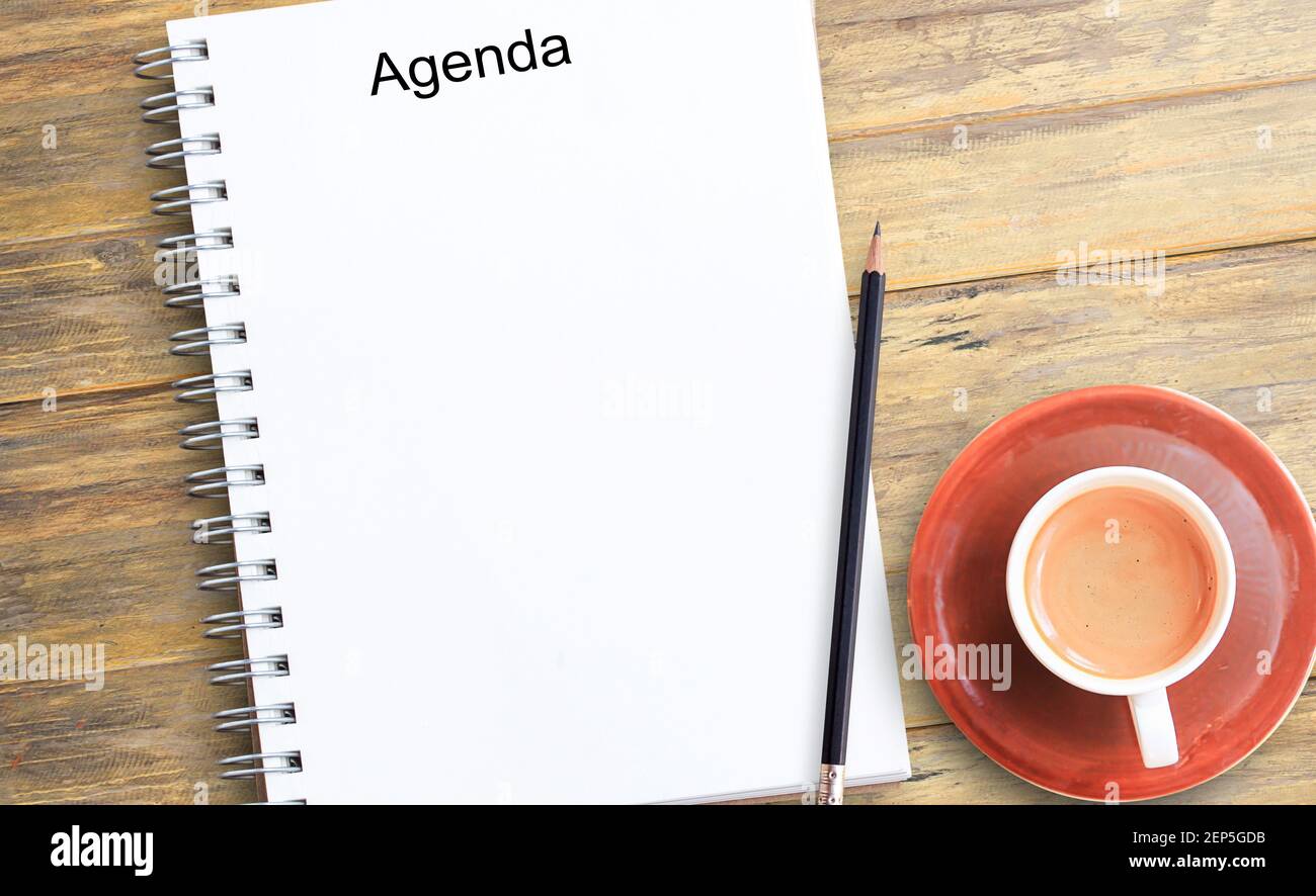 Notepad or notebook with pencil and cup of coffee on brown wood table   wallpaper for education,business  note of the  product Stock Photo - Alamy
