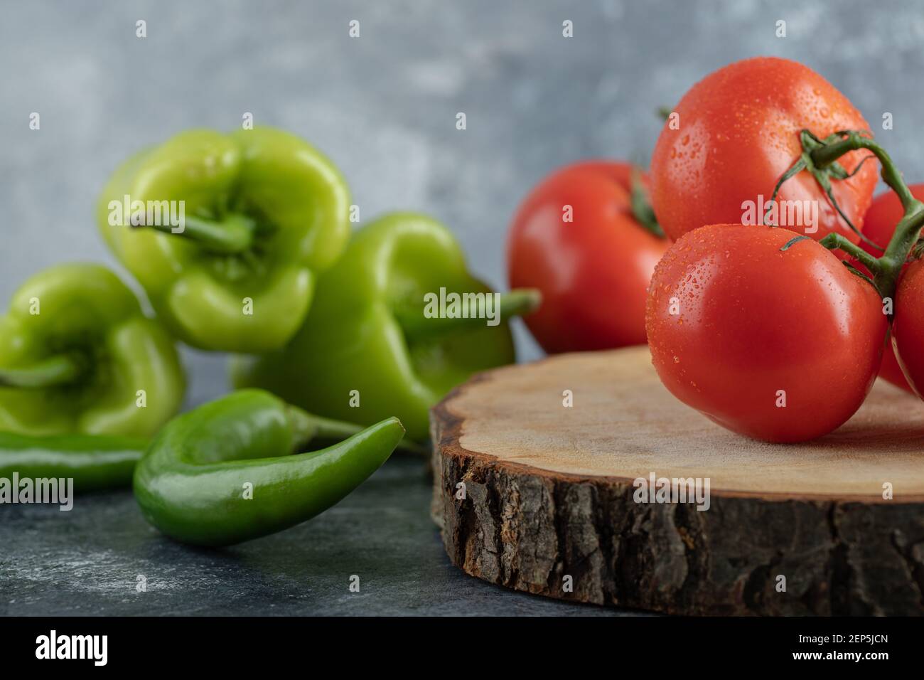 Close up photo of red tomato with green peppers Stock Photo - Alamy
