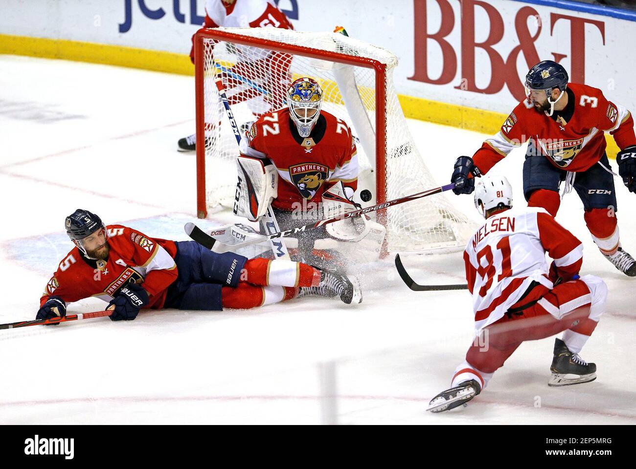 Florida Panthers defensemen Aaron Ekblad (5) and Keith Yandle (3) combine with Panthers goalie Sergei Bobrovsky (72) to deny a shot by the Detroit Red Wings' Frans Nielsen (81) during the first periodÂ at the BB&T Center in Sunrise, Fla., on Saturday, Nov. 2, 2019. The Panthers won, 4-0. (David Santiago/Miami Herald/TNS) Stock Photo