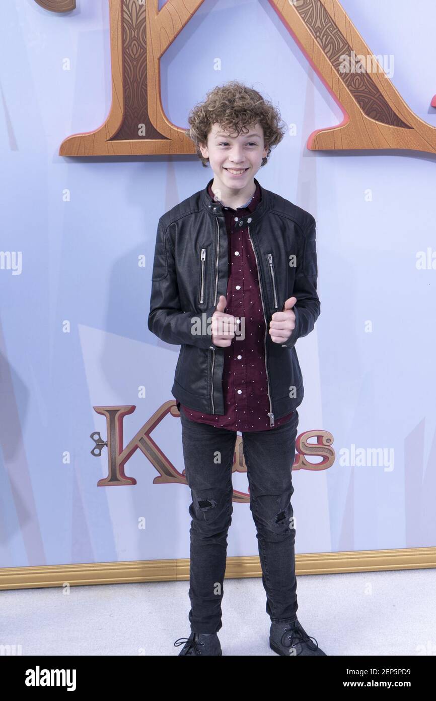 Tucker Meek walking the red carpet for the premiere of Klaus held at