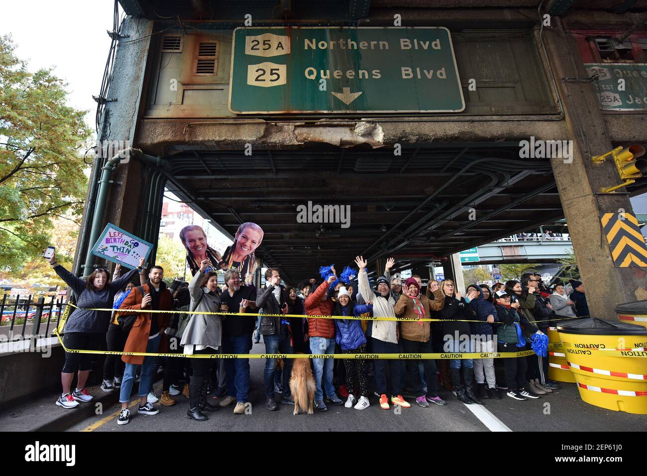 Supports cheers runners on the Queens side of the Ed Koch 59th Street