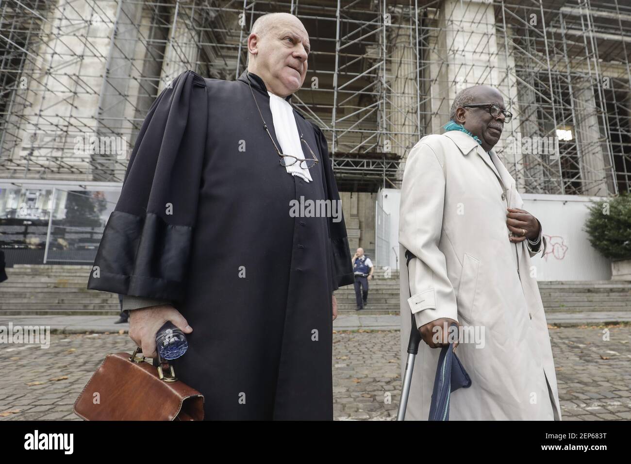 Lawyer Jean Flamme and Accused Fabien Neretse (R) pictured outside the  palace of justice during an evacuation due to a bomb alert at the jury  constitution of the assizes trial of Fabien