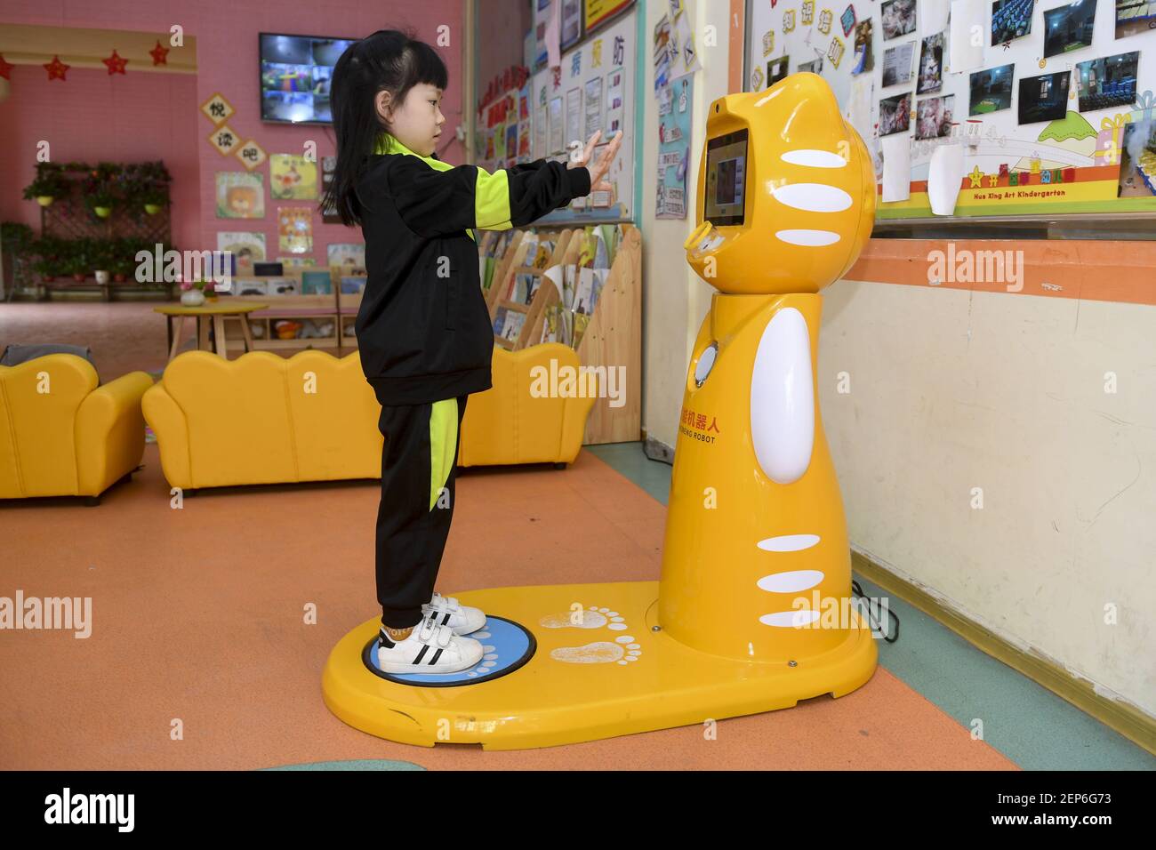 Kids Inspection The robot is doing morning inspection for children in kindergarten in ...