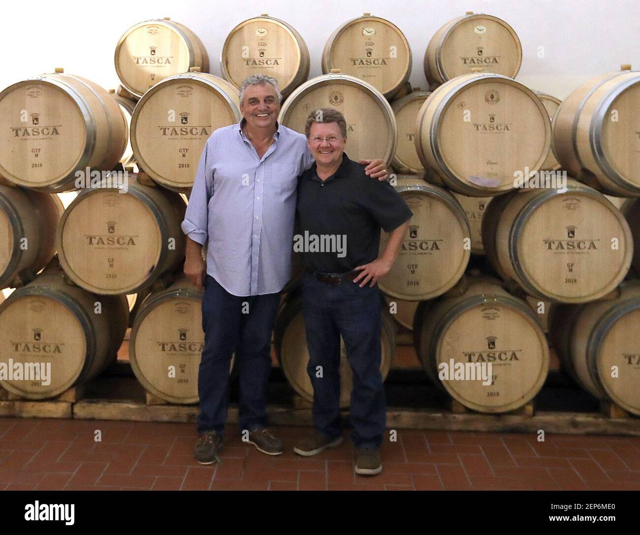 Sal Ferrante and Phil Masturzo during a tour of the barrel room at Tasca 'Almerita - Regaleali Estate on Monday, Sept. 30, 2019 in Sicily. (Cathy Bartholomew/Akron Beacon Journal/TNS) Stock Photo
