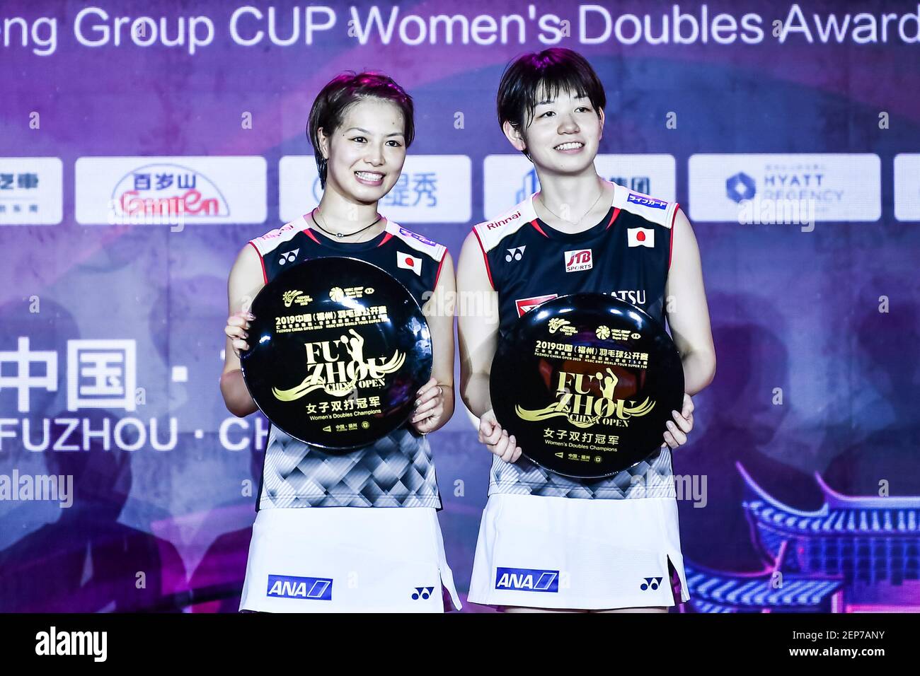Japanese professional badminton players Yuki Fukushima, left, and ...