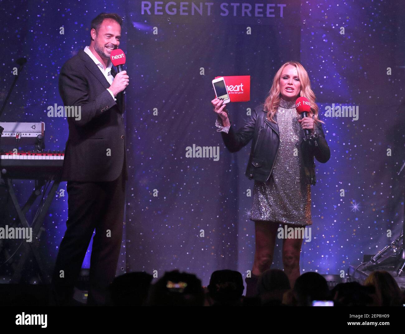 Heart FM Presenters Jamie Theakston and Amanda Holden on stage during