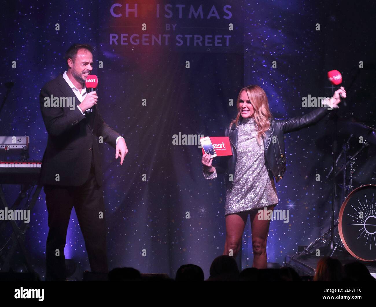 Heart FM Presenters Jamie Theakston and Amanda Holden on stage during